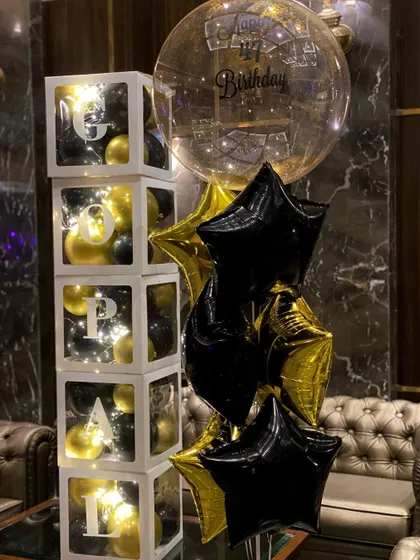 The perfect duo for a birthday surprise. This set includes a personalized helium balloon bouquet and custom balloon cubes that spell out a name, lit from within with fairy lights.