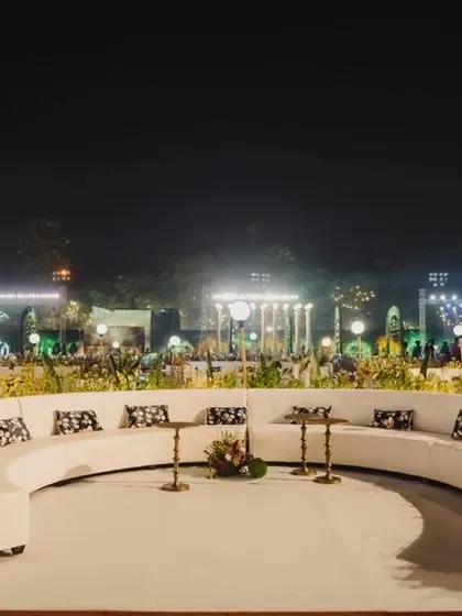 A wide view of the custom-designed curved lounge seating at the entrance of a reception. This setup ensures that the guest experience begins with comfort and style from the moment they arrive.