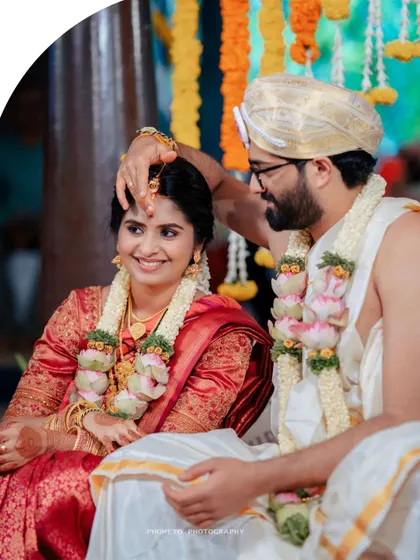 A close-up of a key wedding ritual, captured with a focus on the couple's happy and serene expressions.