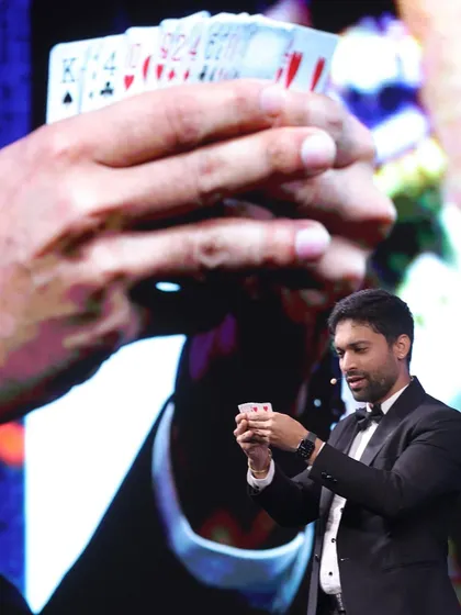 A close-up sleight of hand, projected onto the big screen for everyone at the IHCL conference to see. This ensures that even the most intricate card magic is a shared experience for hundreds of people at once.