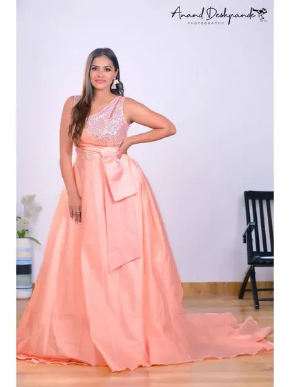 Another angle of the peach ball gown, a perfect rental for any formal event.