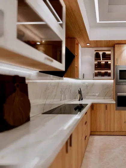 A close-up render of a kitchen that blends natural wood with white cabinets and a marble backsplash. The design includes integrated appliances for a seamless look.