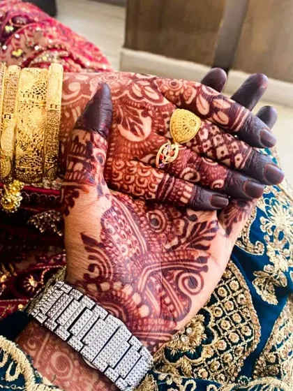 A close-up of a mature bridal stain. Notice the deep, almost black, color on the fingertips and the rich burgundy on the palm. This is the result I strive for with every client.