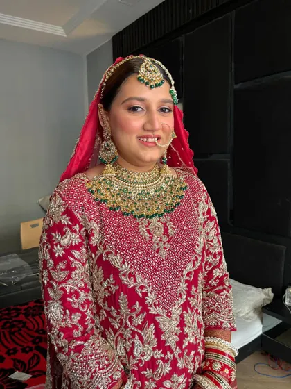 A full-frontal view of the Nikkah bride. The makeup is minimal and fresh, with a focus on clean skin and subtly enhanced features, as she requested.