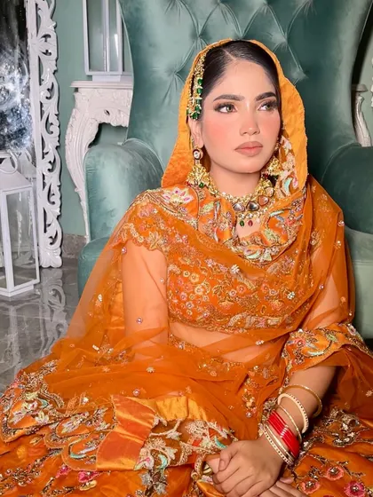 The way the dupatta is draped here adds a traditional touch to a modern look. The makeup remains flawless, with a focus on a matte, airbrushed finish.