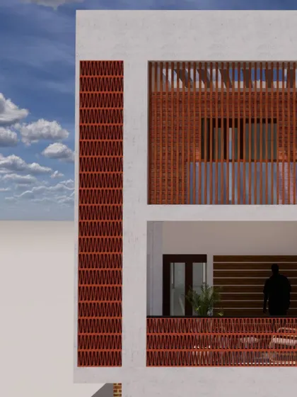 A close-up of an elevation detail, showing the use of a terracotta jali screen. This traditional element is used in a modern context to provide ventilation and privacy while adding a decorative, textured facade.