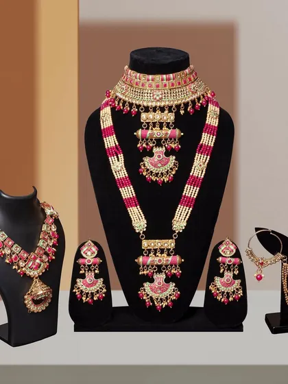 Another grouping of intricate bridal jewelry sets, shot against a clean, modern background. This allows the vibrant colors and detailed craftsmanship of the pieces to stand out.