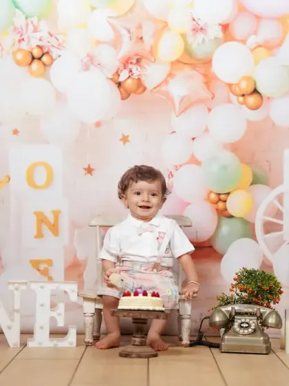A classic first birthday studio session, complete with a festive balloon backdrop, a personal cake, and lots of smiles. My studio is equipped to create the perfect celebratory atmosphere for this special milestone.