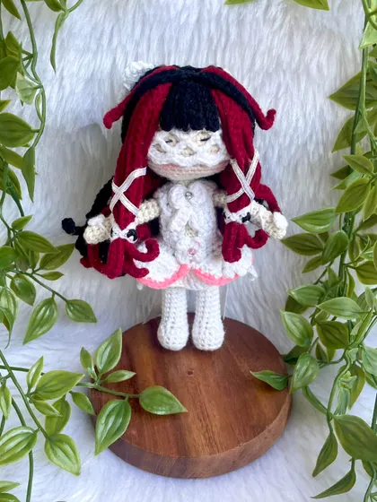 This is Columbina Damselette, a beautifully detailed anime character. The intricate hairstyle with red and black locks and the delicate white dress was a challenge I truly enjoyed creating.