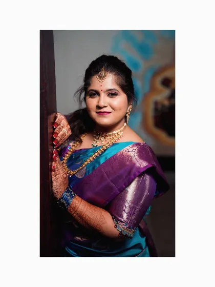 Our beautiful client celebrating her Bale Shastra (baby shower) in a custom designed blue and purple silk saree and blouse.