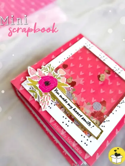 The cover of a vibrant pink mini scrapbook with a fun shaker window. It's designed to make your heart smile!