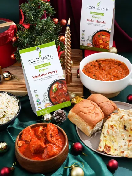A festive feast styled for a Christmas campaign. I paired these ready-to-cook Indian curry kits with traditional breads and holiday decor to create a warm, inviting scene for a holiday meal at home.