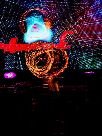 A final long-exposure image from the same event, this time with a face projected on the screen. The combination of elements created a truly unique and artistic show.