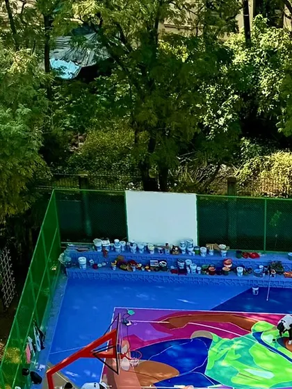 The early stages of the massive NBA 2K court project. You can see the paint buckets lined up, ready for the huge task of covering the entire surface with layers of colour and story.