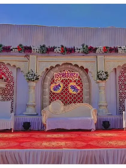 This is a Rajwada theme stage I created for an engagement. It features traditional arches, pillars, and a detailed backdrop, giving the event a royal and ethnic feel.
