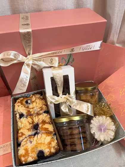 Another angle of my packed hamper, showing how all the goodies fit together. You can see the teacake, brownie box, cookie jars, and a decorative candle, all ready to be gifted.