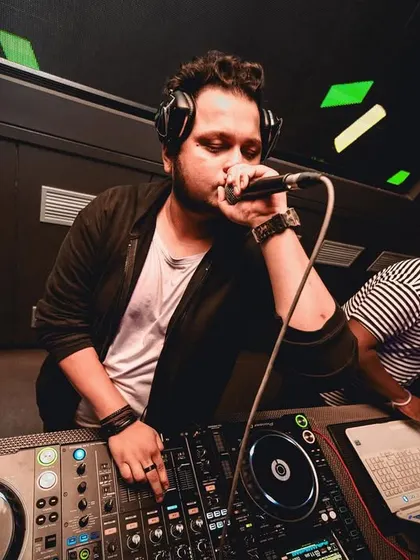 On the mic, wishing everyone a Happy New Year. A shot that shows my role as an MC and party host.