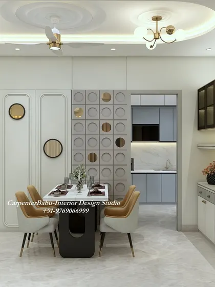 The dining area is separated from the kitchen by a wall with a geometric cutout partition, allowing for visual connection while defining the space.