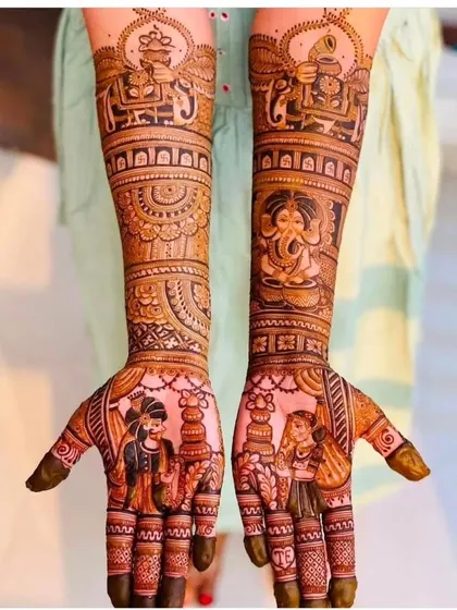 A blend of divine and personal. This design features portraits of the bride and groom on the palms, with Ganesha and doli scenes on the arms for blessings and celebration.