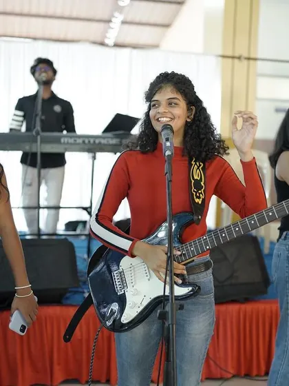 That awkward smile when you mess up the lyrics but your bandmates have your back. Live music is beautifully imperfect.