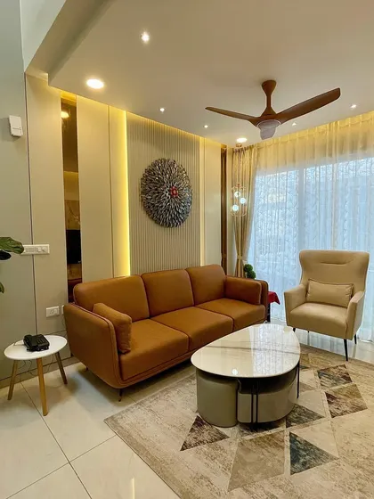 Here, you can see how I used vertical wall paneling and integrated lighting to add depth and character. A large potted plant brings a touch of nature indoors, balancing the modern design elements.