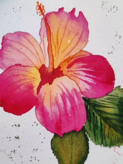 Another angle of the hibiscus painting, highlighting the texture of the paper and the granulation of the pigments.