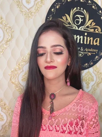 A soft and pretty look with pink eyeshadow and a matching pink lace top.