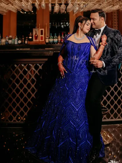 A beautiful moment between a couple, with the bride wearing my active blue corset lehenga. A statement in every sense.