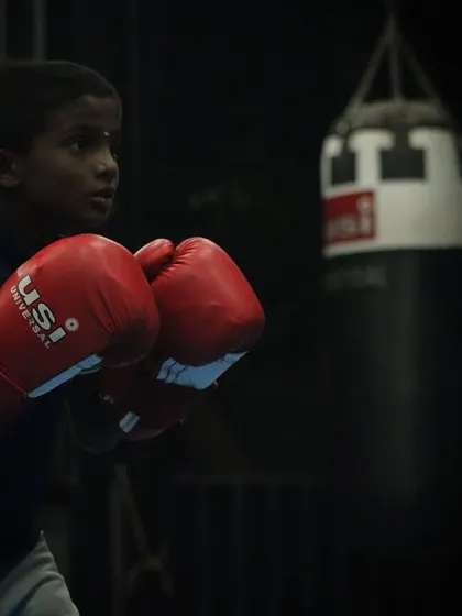 A young boxer in his stance, ready for action. We teach them to be calm and focused, even in the heat of the moment.
