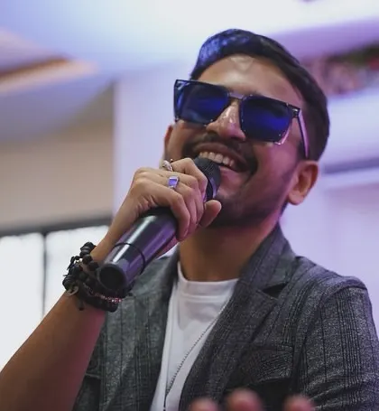 A happy shot from a performance. The joy on my face reflects the joy I feel when I sing.