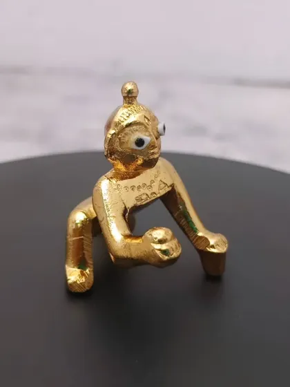 A charming Panchaloham baby Krishna idol. This crawling Krishna, or Laddu Gopal, is perfect for your home shrine and makes a wonderful gift.