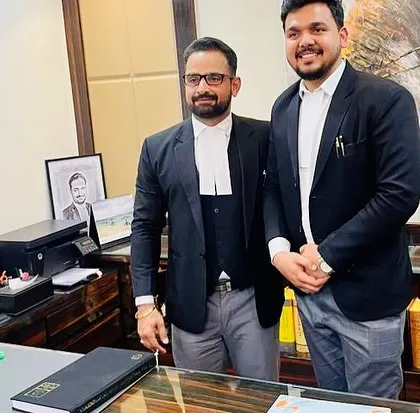 A picture with a newly enrolled advocate in my chamber. My office is a place for both serious legal work and celebrating personal achievements.