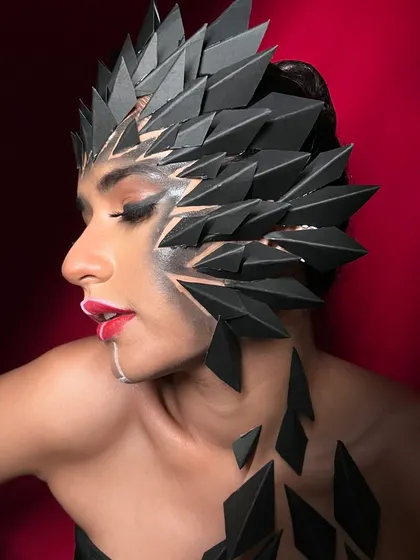 A side profile of the fantasy look, giving a clear view of how the prosthetic pieces are integrated with the hair and makeup.