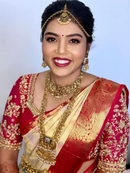 Prerana looking radiant for her Muhurtham. We paired a bold lip with glowing skin for a classic yet fresh bridal look.
