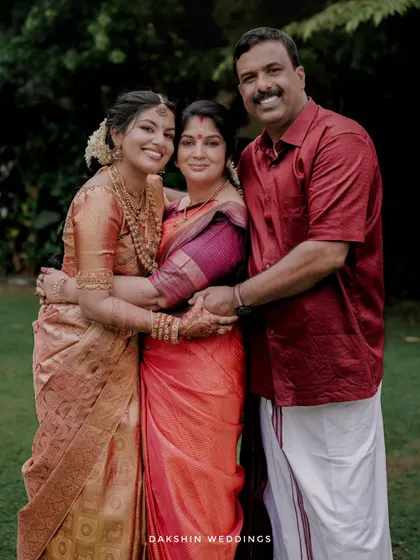 A heartwarming family portrait, capturing the bride with her parents. I make sure to document the important family bonds that are central to any wedding.