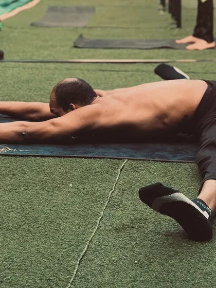 Another view of the pancake stretch, a challenging but rewarding pose for improving hip flexibility.
