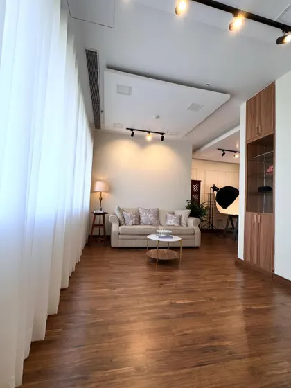 Another view of the studio's living room set, a comfortable and stylish space for lifestyle product shoots.