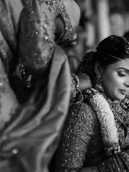 A timeless black and white image of the Mangalyam ceremony. Stripping away the color focuses the viewer's attention on the emotion and significance of the act.