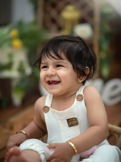 That pure, uncontainable joy. This is what we aim for in every child portrait session. By keeping the setup simple, we let your little one's infectious smile and sparkling eyes become the entire story.