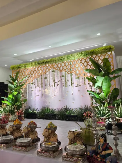 A side view of the stage, showing the row of cow props with offerings.