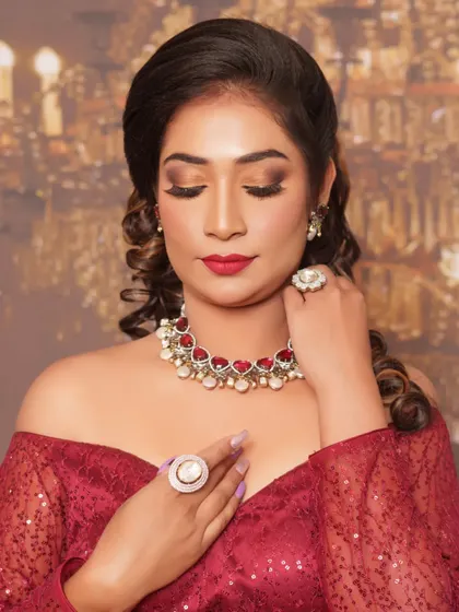 Another angle of this beautiful reception look, showing how the makeup and jewellery come together. The ruby and diamond necklace is the perfect accessory for the golden smokey eye and red lip combination.