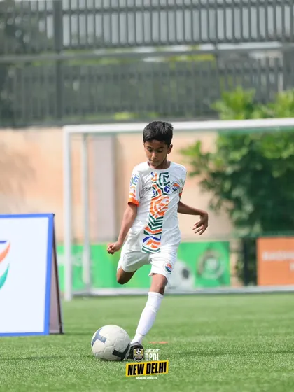 A young player practices his shooting technique. We break down every aspect of the game to ensure our players master the fundamentals.