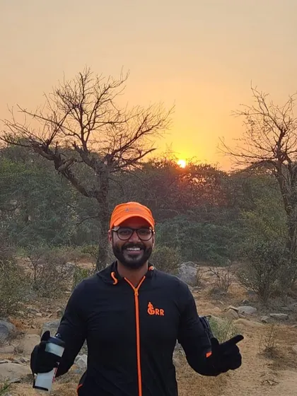 A runner posing against the sunrise at the Aravali Trail Run. The beauty of nature is a reward in itself.