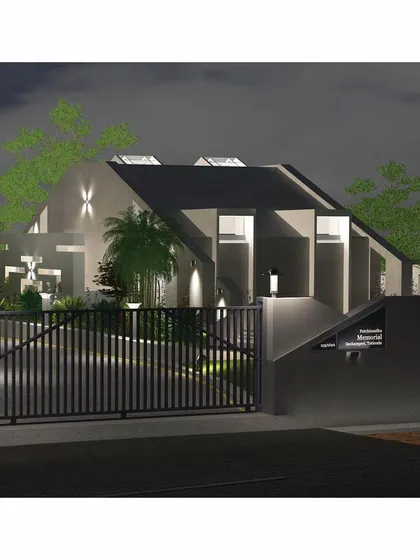A night-time render of the memorial's entrance. Strategic lighting highlights the architectural form and ensures the space feels welcoming and secure after dark.