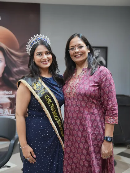 A happy moment between a client and a team member. Building warm relationships with our clients is just as important as the services we provide.