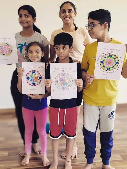 Posing with the beautiful mandala art the kids created for their moms on Mother's Day. A perfect blend of mindfulness and creativity.