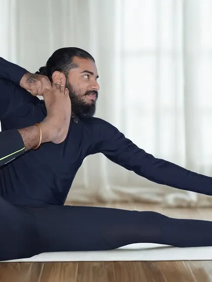 Me demonstrating Akarna Dhanurasana, the Archer’s Pose.