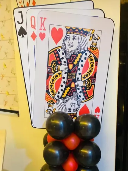Another custom prop for a card party. This standee shows large cutouts of the Jack, Queen, and King cards, which can be placed around the event space to enhance the theme.
