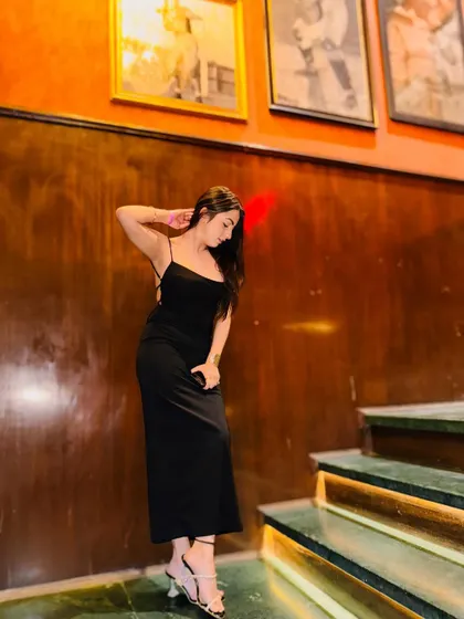 You had what everyone wanted, now it's your loss. A moody, confident shot on the stairs in a stunning black gown.