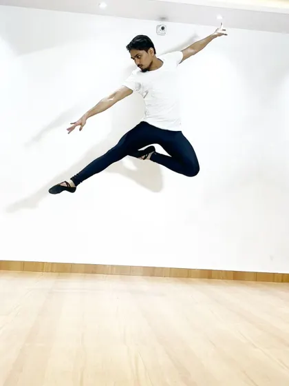 A powerful jump, or "grand jeté," frozen in mid-air. My training for male ballet dancers focuses on developing the power and technique needed for such athletic movements.